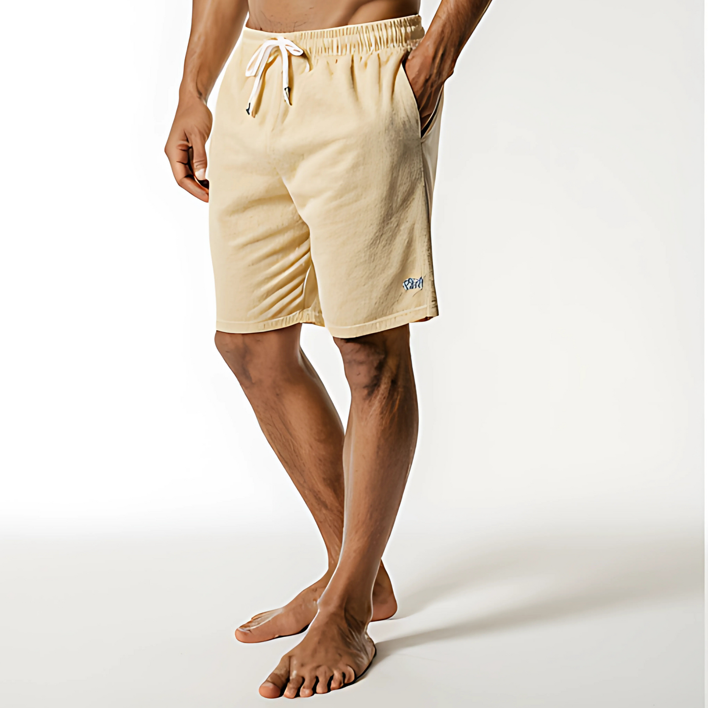 Model wearing Resort Terry Swim Short in light yellow, featuring an elastic waistband with drawstring, ideal for beachwear.