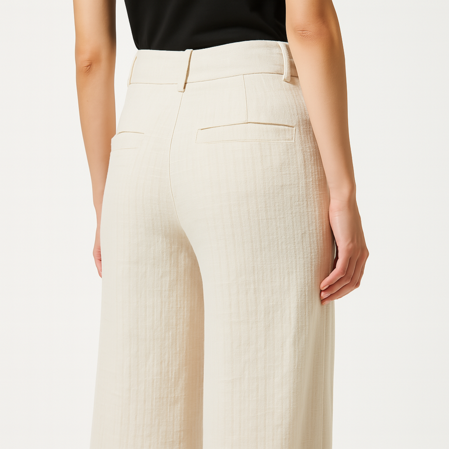 Back view of Cadence Wide-Leg Trouser in Ivory Linen-Viscose Blend, featuring stylish waistband and side pockets.