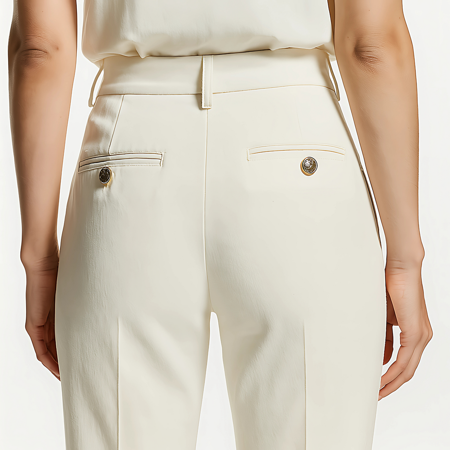 Back view of The Marais Trouser in Soft Ivory with structured waistband, belt loops, and back welt pockets, tailored for modern minimalism.