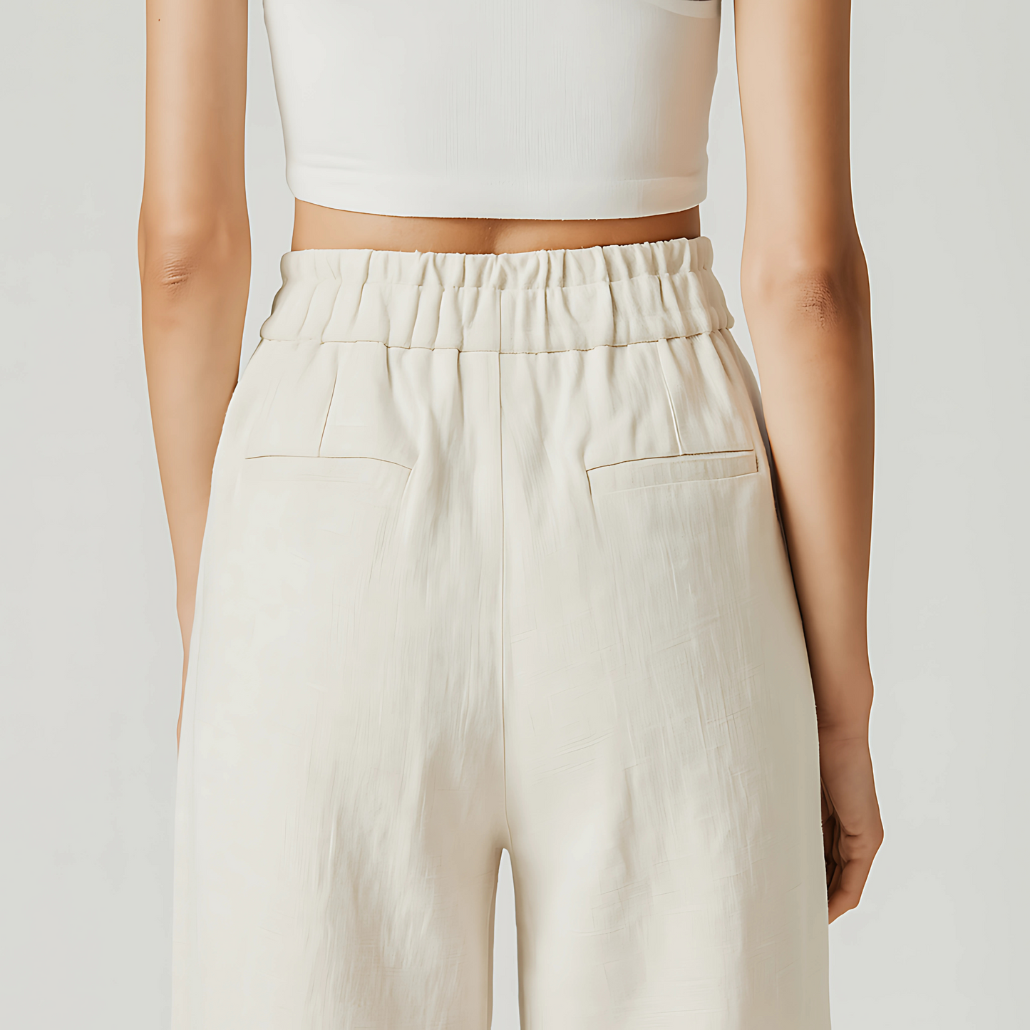 Back view of Solana Linen Trouser in Ivory, featuring a high-waisted fit and wide-leg design.