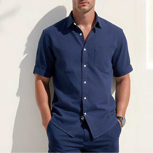 Model wearing the Aegean Set in Deep Marine, featuring a relaxed short-sleeve button-down and shorts, ideal for coastal dressing and resort wear.