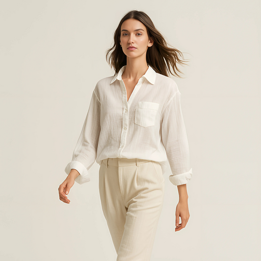 Model wearing Aire Button-Down Shirt, lightweight and breathable with long sleeves, perfect for resortwear and summer looks.