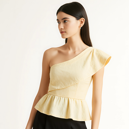 Model wearing asymmetric ruffle top with one-shoulder design and peplum hem, ideal for contemporary eventwear.