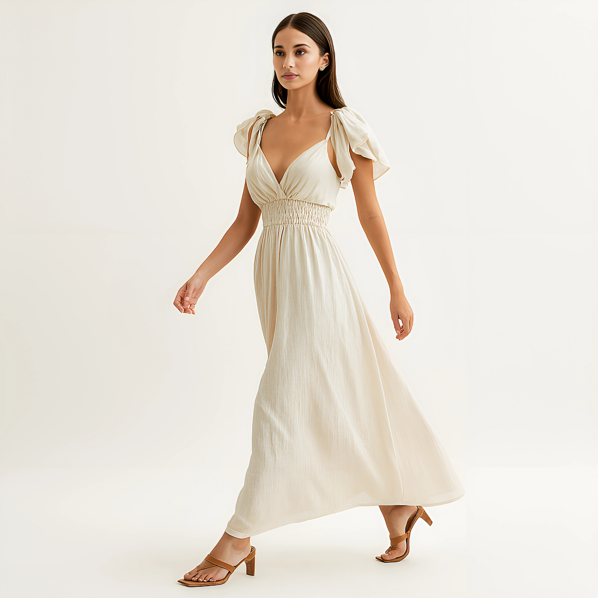 Delphine Ruffle Strap Maxi Dress in Ivory with smocked waistband, ideal for beach events, spa, or bridal settings.