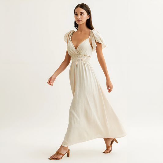 Delphine Ruffle Strap Maxi Dress in Ivory with smocked waistband, ideal for beach events, spa, or bridal settings.