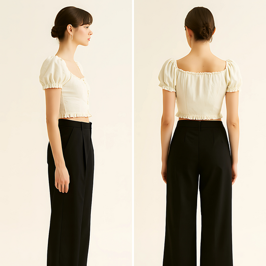 Model wearing a linen button crop top with puff sleeves, square neck, and ruffle trim in natural color, viewed from side and back.
