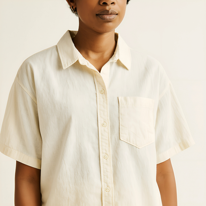 Unisex oversized camp shirt in natural color, featuring a relaxed fit, short sleeves, and a camp collar, made from lightweight cotton-linen.