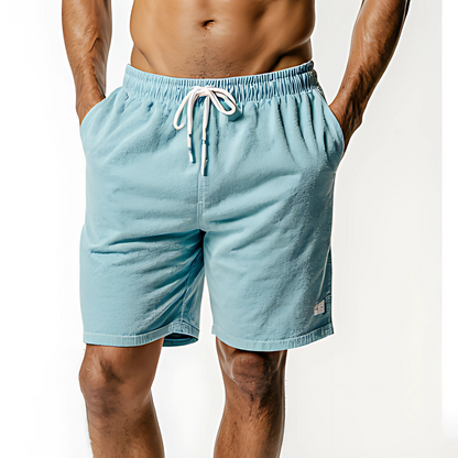 Light blue resort terry swim shorts with drawstring, ideal for beach and poolside relaxation.