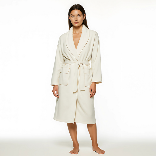 Luxuriously soft Aedon Spa Robe in ecru, featuring a shawl collar, patch pockets, and self-tie belt, for spa and wellness environments.