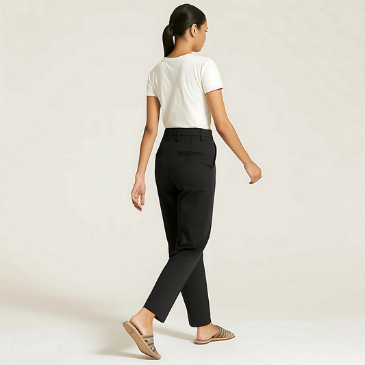 Model wearing The Amalfi Tailored Trouser in Jet Black, showcasing tailored design and versatility for uniforms and capsule wardrobes.